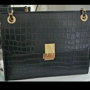 Black purse with gold chain strap